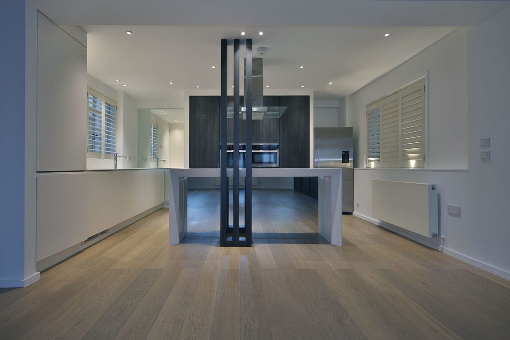 Premium open plan kitchen and dining area showcasing high-end wooden flooring and minimalist architecture by Vanity Pix ( @vanitypix )